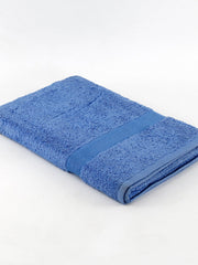 Cornflower-blue cotton bath towel folded diagonally with a ribbed woven border