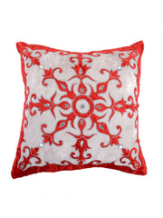 Ivory cushion cover with a red aari embroidered ornamental medallion at the centre