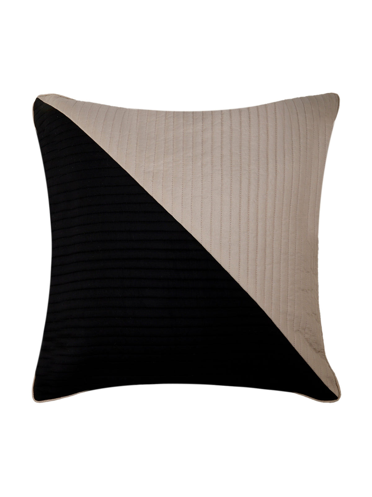 Cushion cover split diagonally into a black quilted half and a pale taupe quilted half