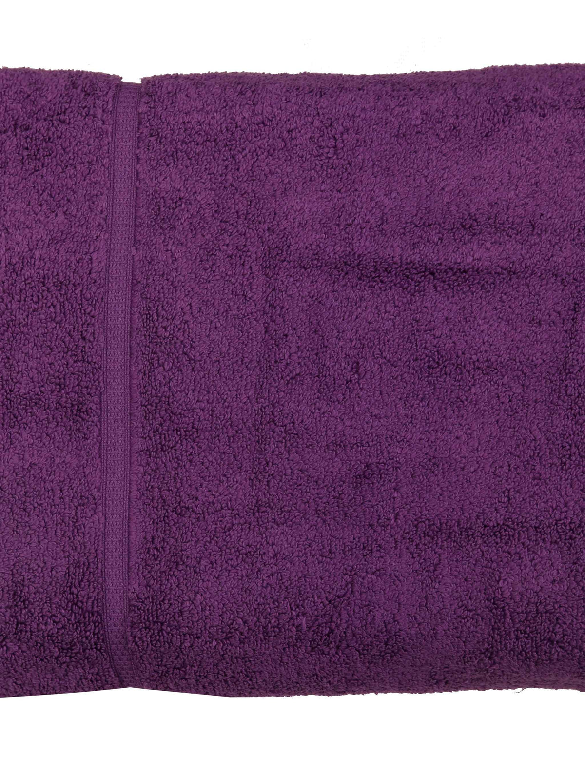 Deep purple cotton bath towel, close-up rolled view showing the woven dobby border