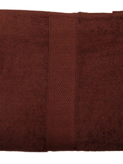 Rich chocolate-brown cotton bath towel, close-up flat view showing the honeycomb woven border