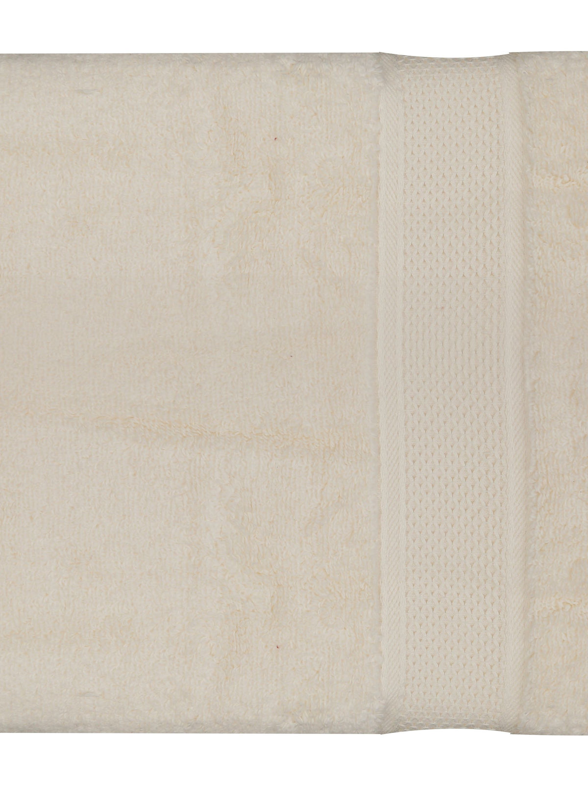 Cream cotton bath towel with a textured dobby band border, folded, 30x60 inch