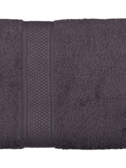 Charcoal-grey cotton bath towel, close-up rolled view showing the honeycomb woven border