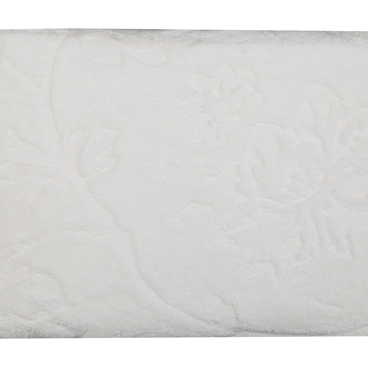 White cotton beach towel, close-up view of the textured terry fabric