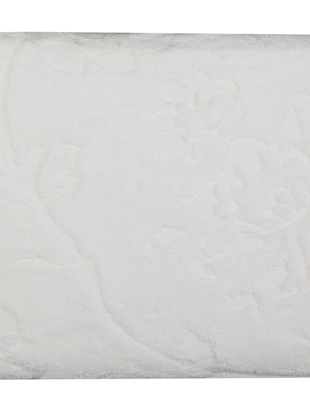 White cotton beach towel, close-up view of the textured terry fabric