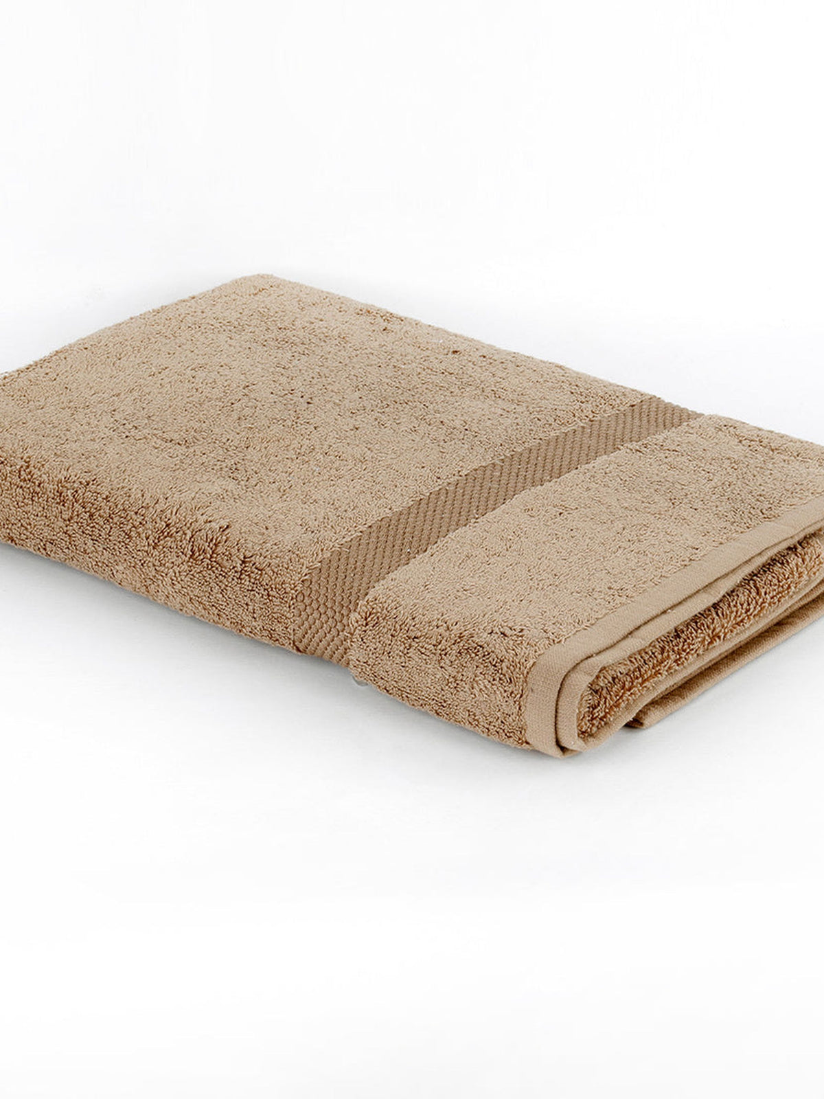 Sand-beige cotton bath towel folded on a white background with a ribbed woven border