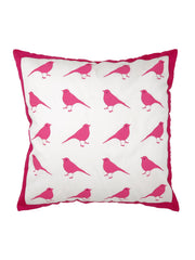 White cotton cushion cover printed with rows of pink birds inside a magenta border