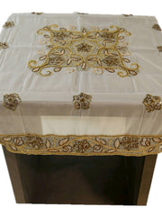Off-white organza table cover with a gold-beaded floral medallion embroidered at the centre and a scalloped gold-beaded lace border