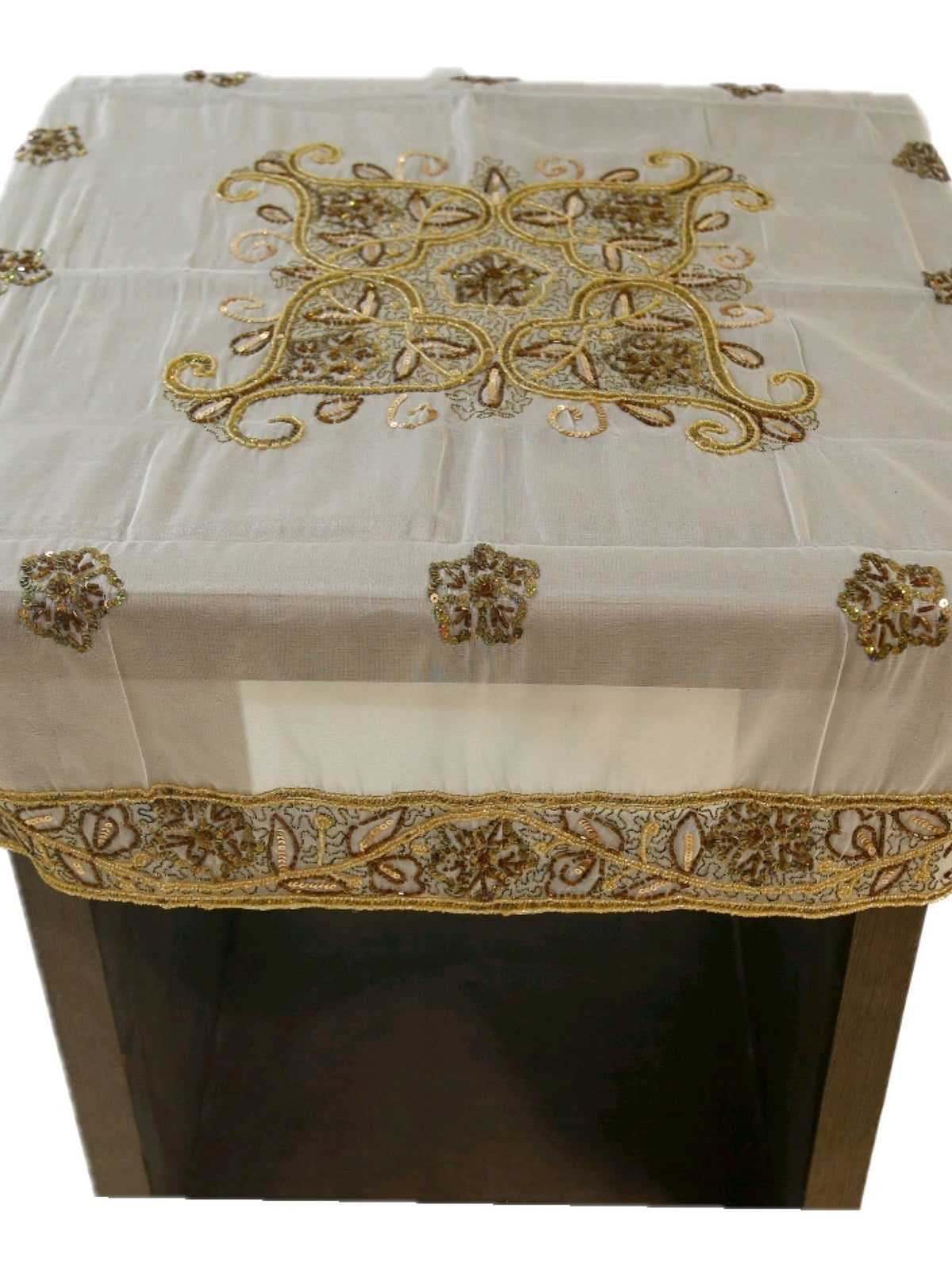Off-white organza table cover with a gold-beaded floral medallion embroidered at the centre and a scalloped gold-beaded lace border
