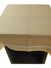 Solid beige linen table cover with a multicolour striped trim along the edge