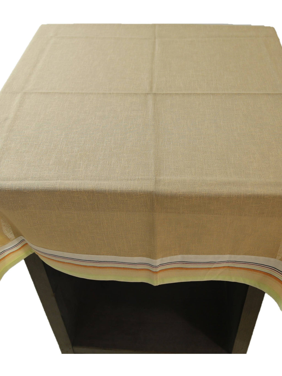 Solid beige linen table cover with a multicolour striped trim along the edge