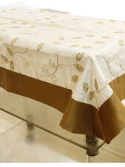 Cream table cover with a gold embroidered leaf-and-vine pattern and a solid brown border