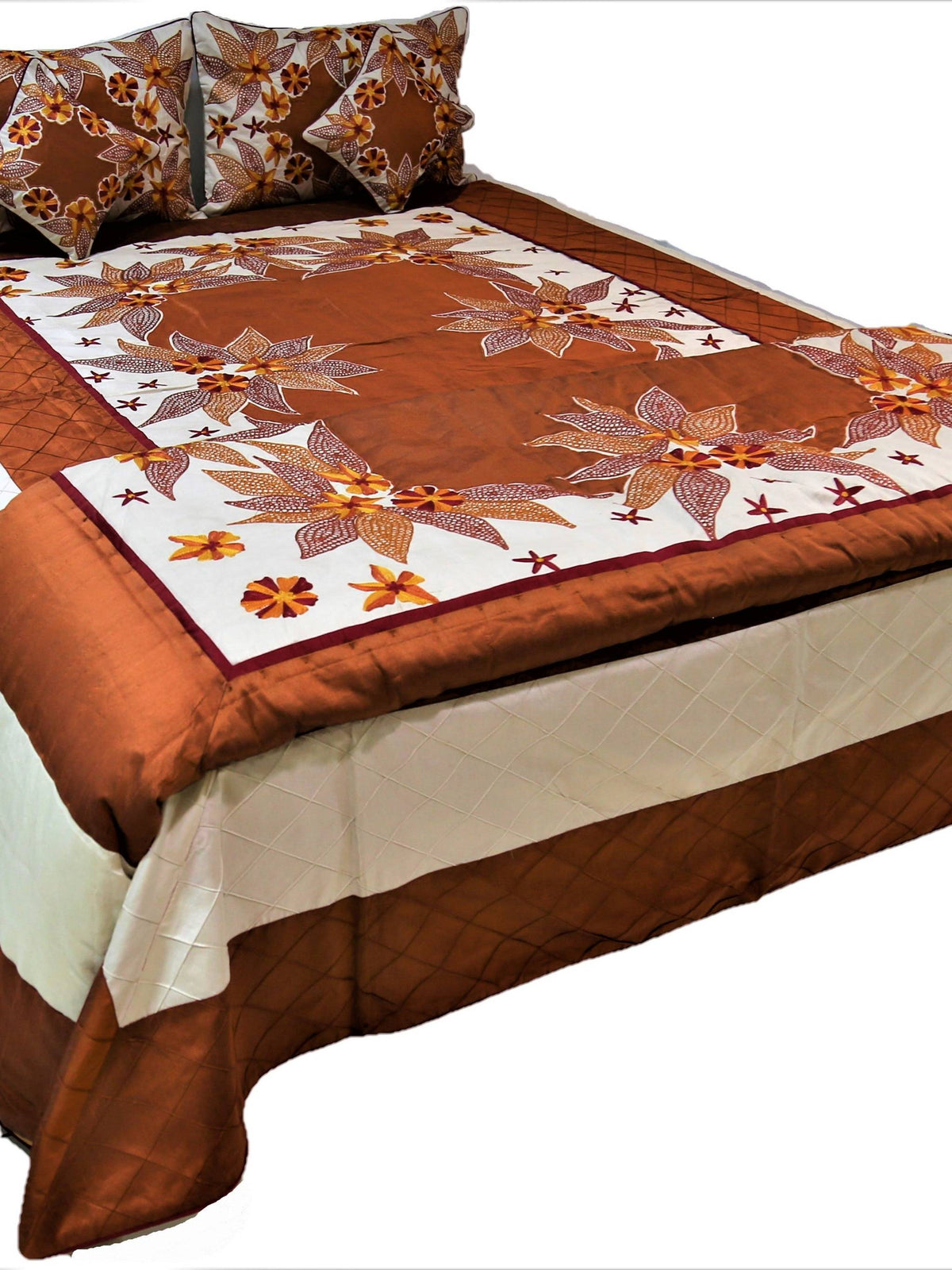 Rust brown and cream wedding bedcover set with white floral embroidery on a double bed