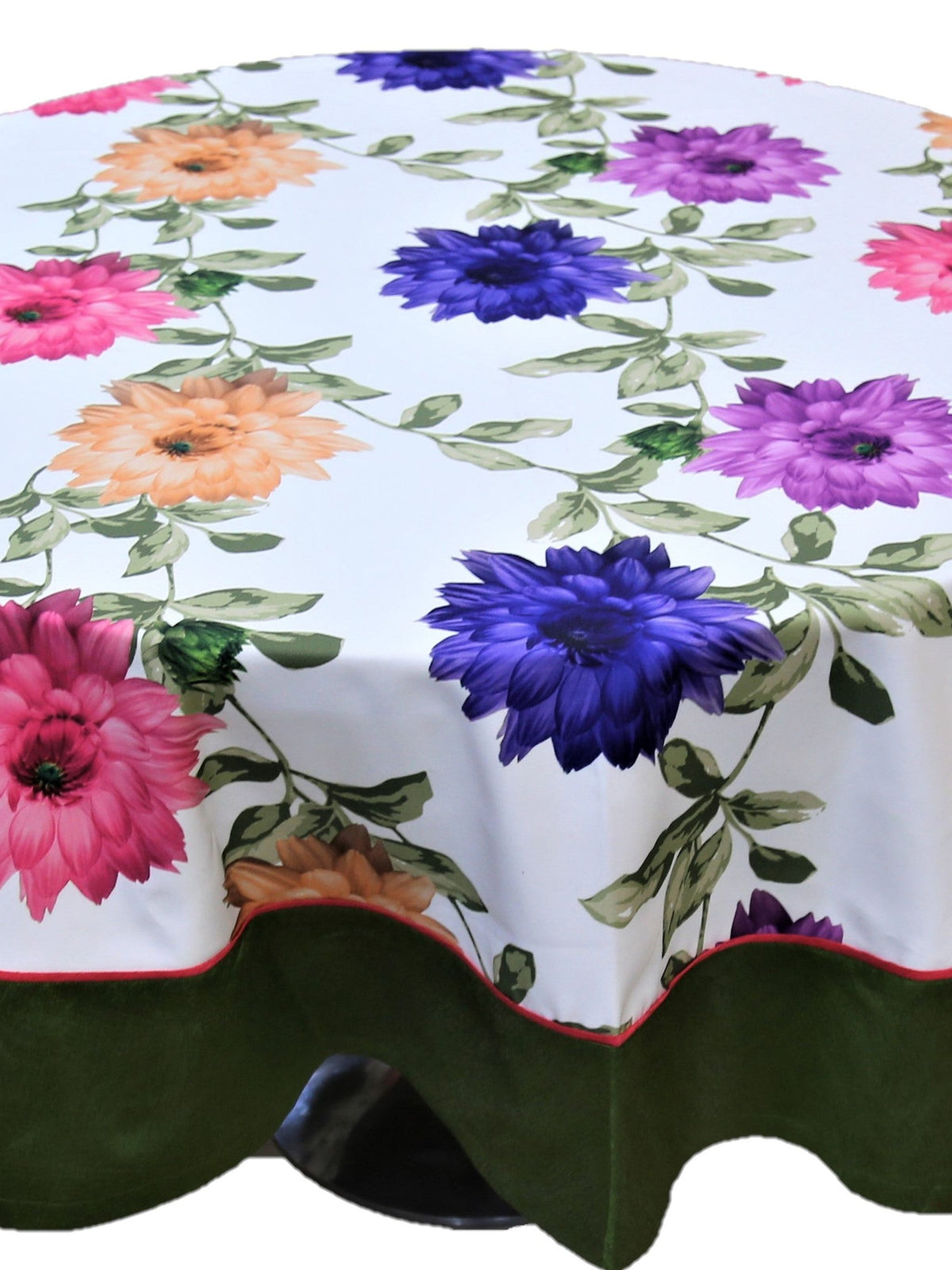 Round white table cover with a large multicolour floral print and a solid olive-green underskirt with red piping