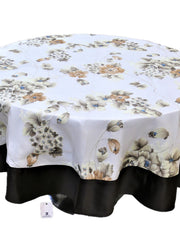 Round white table cover with a printed beige-brown floral bouquet pattern and a solid black underskirt