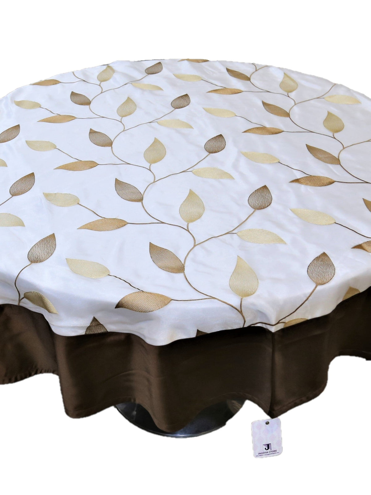 Round cream table cover with a beige-gold embroidered leaf-vine pattern and a solid dark brown underskirt