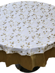 Round cream table cover with a gold-brown embroidered leaf-vine pattern and a matching gold-brown underskirt
