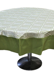 Round table cover with a cream geometric diamond print on top and a solid olive-green underskirt