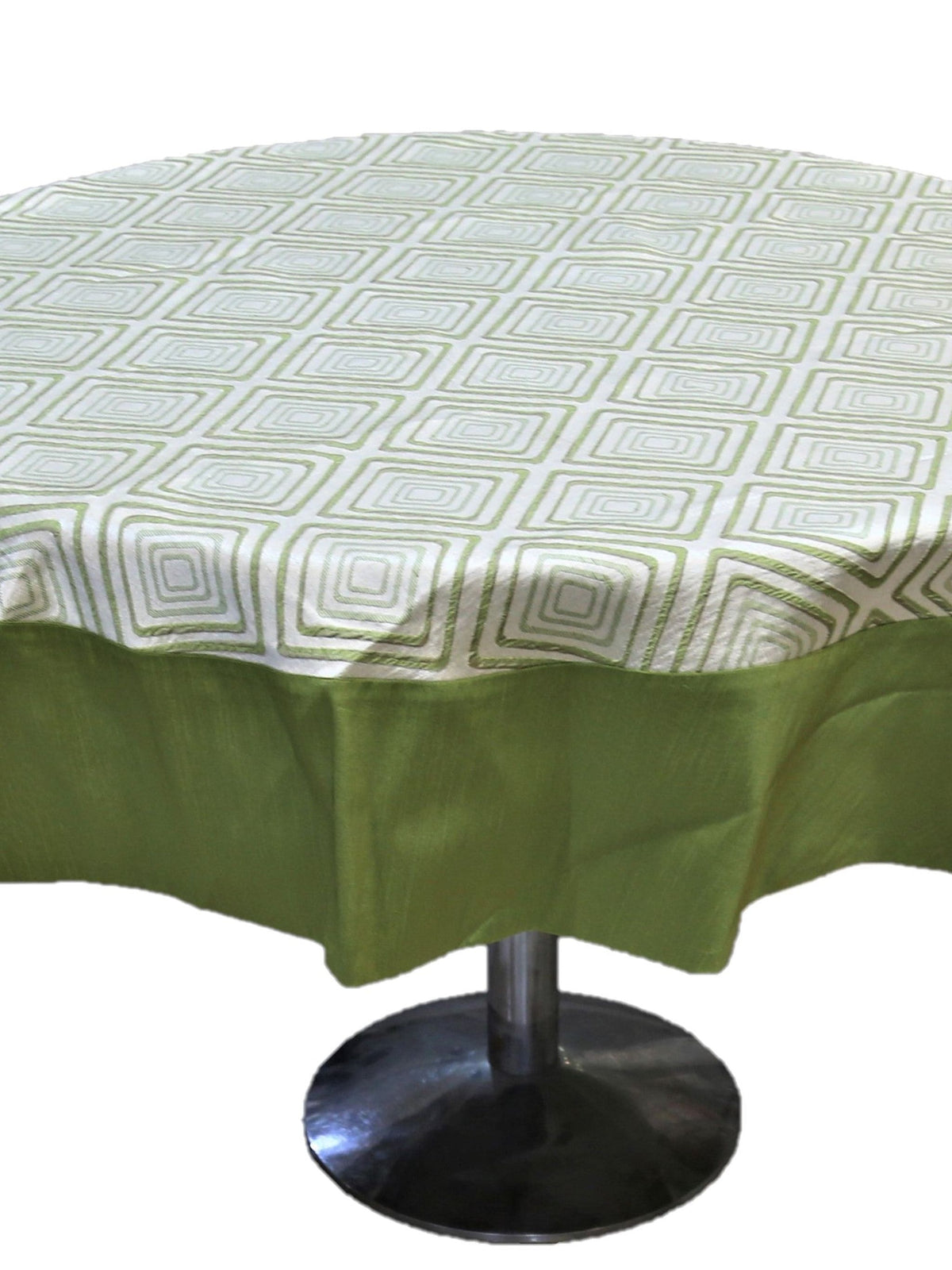 Round table cover with a cream geometric diamond print on top and a solid olive-green underskirt