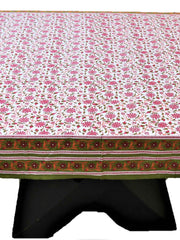White table cover with a pink block-printed floral vine pattern and an olive-green border with a pink and maroon embroidered floral strip