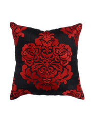 Black cushion cover with a large red flocked damask motif at the centre