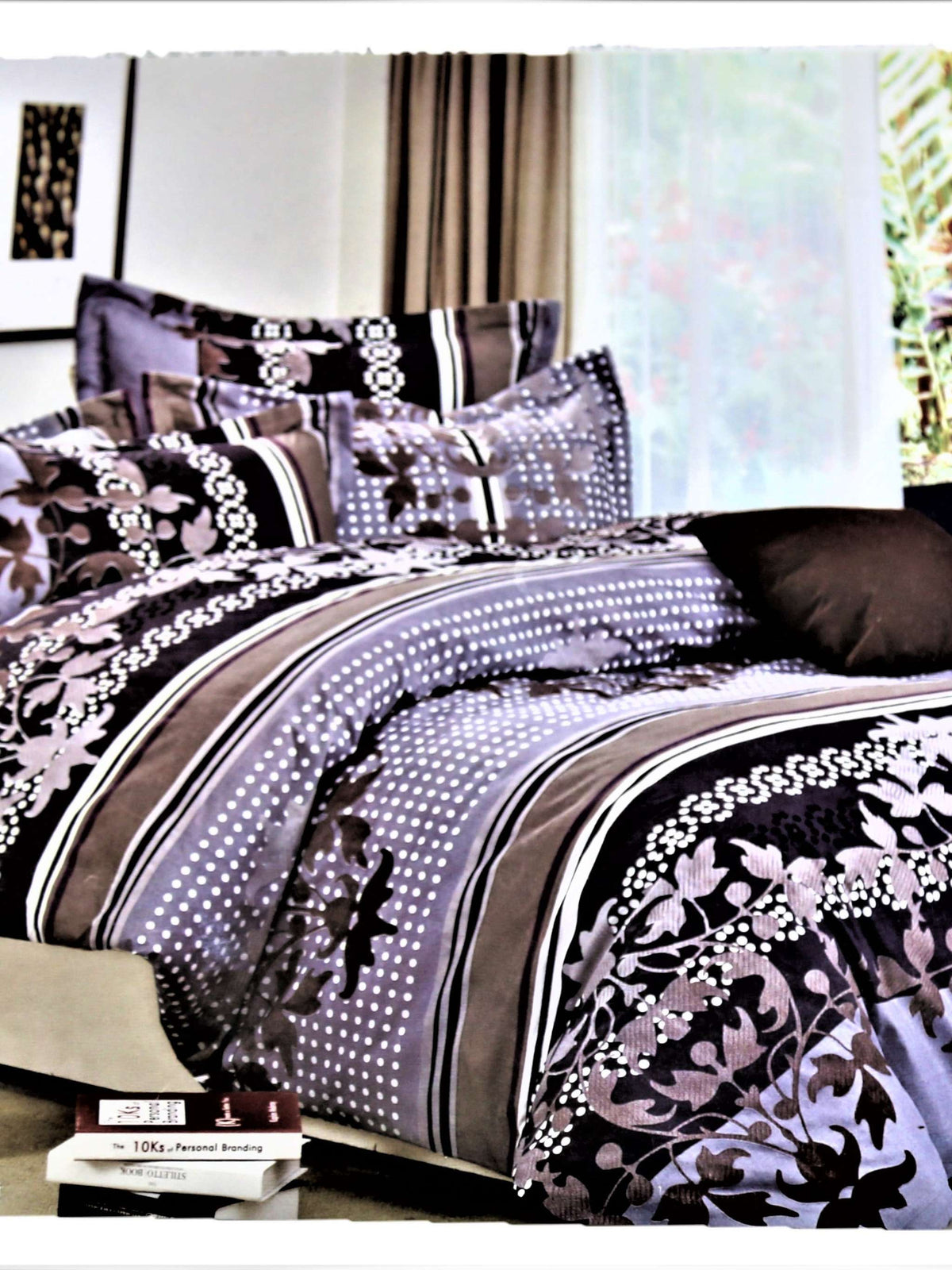 Grey, black and mauve floral and polka-dot striped print bedsheet and duvet set, styled on a bed with matching pillows