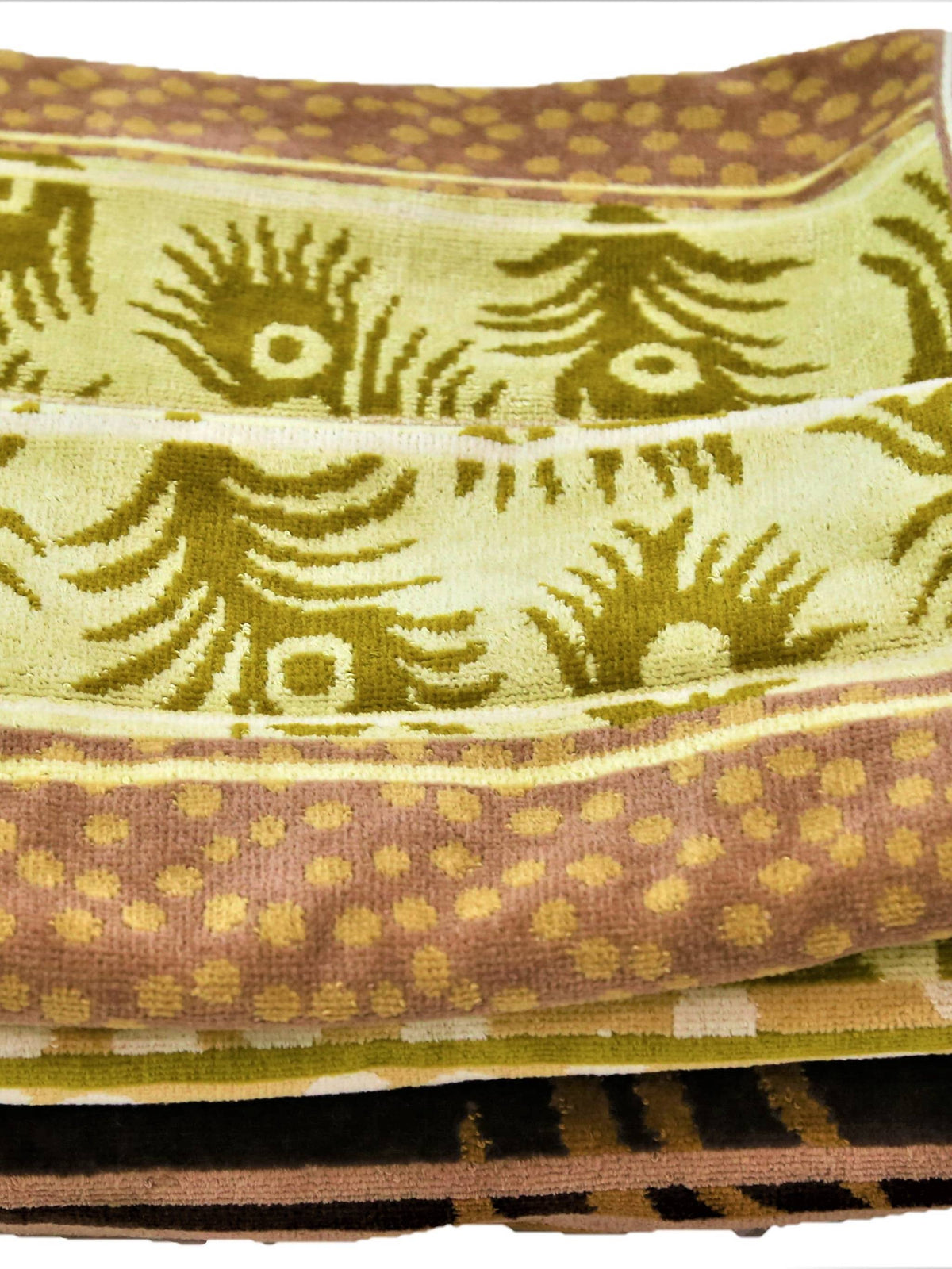 Golden-olive cotton towel set with a woven paisley-feather motif