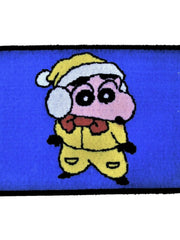 Blue kids play mat with a cartoon boy in a yellow Santa suit and cap with white trim, 45x75 cm