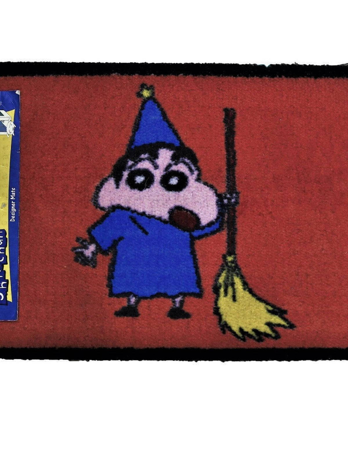 Red kids play mat with a cartoon boy in a blue wizard robe and pointed hat holding a broom, 40x60 cm