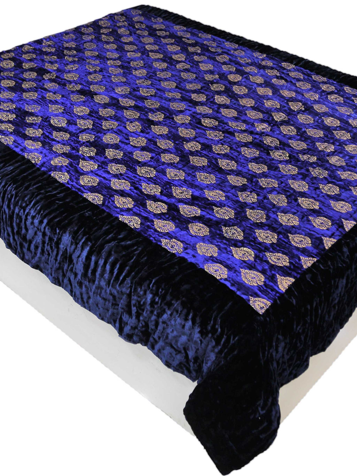 Deep blue chenille quilt with gold foil paisley print and navy border