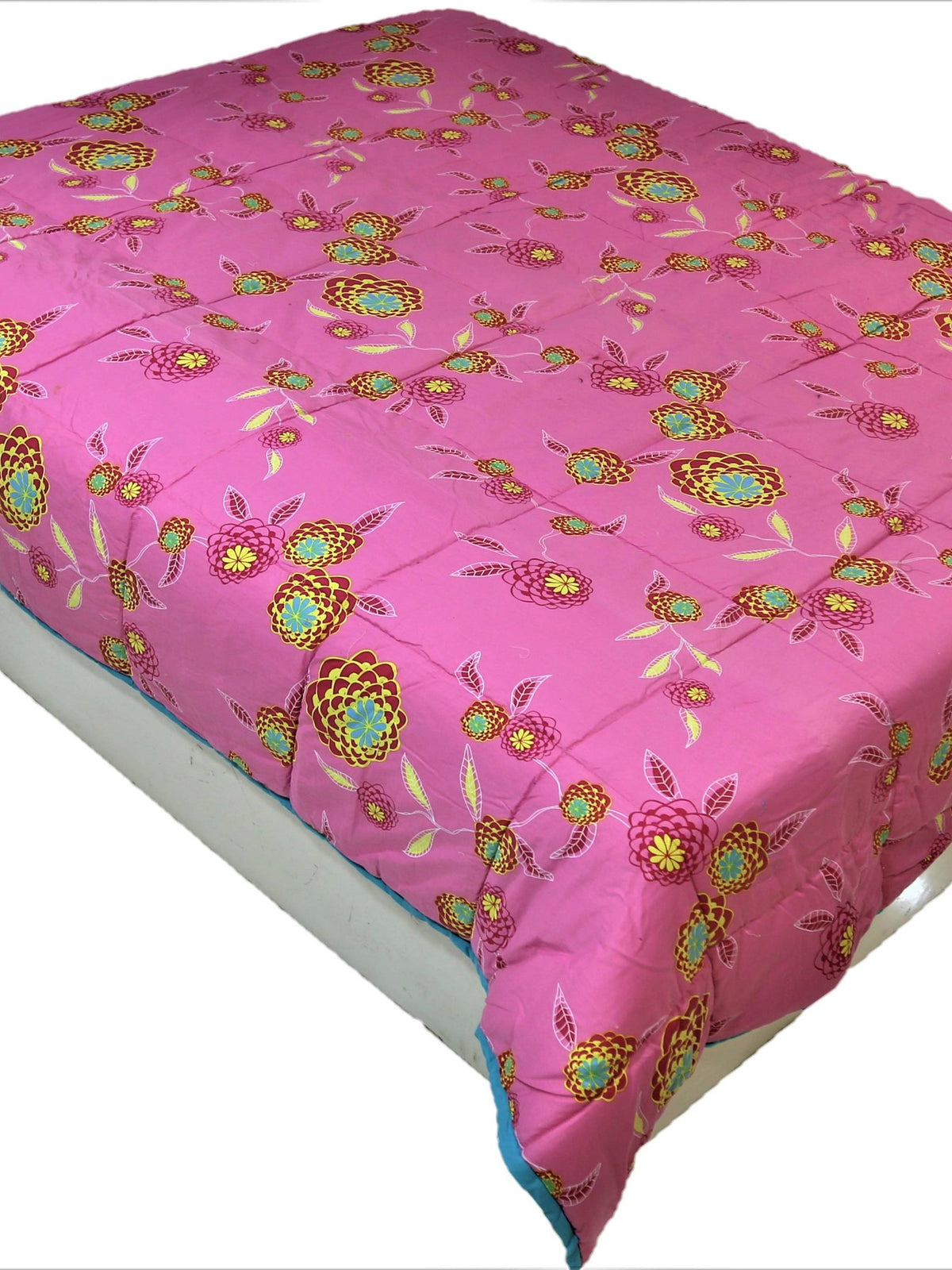 Pink floral print reversible cotton AC quilt for a double bed