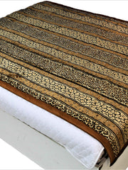 Brown and gold blanket-weight single bed quilt with leopard-inspired print
