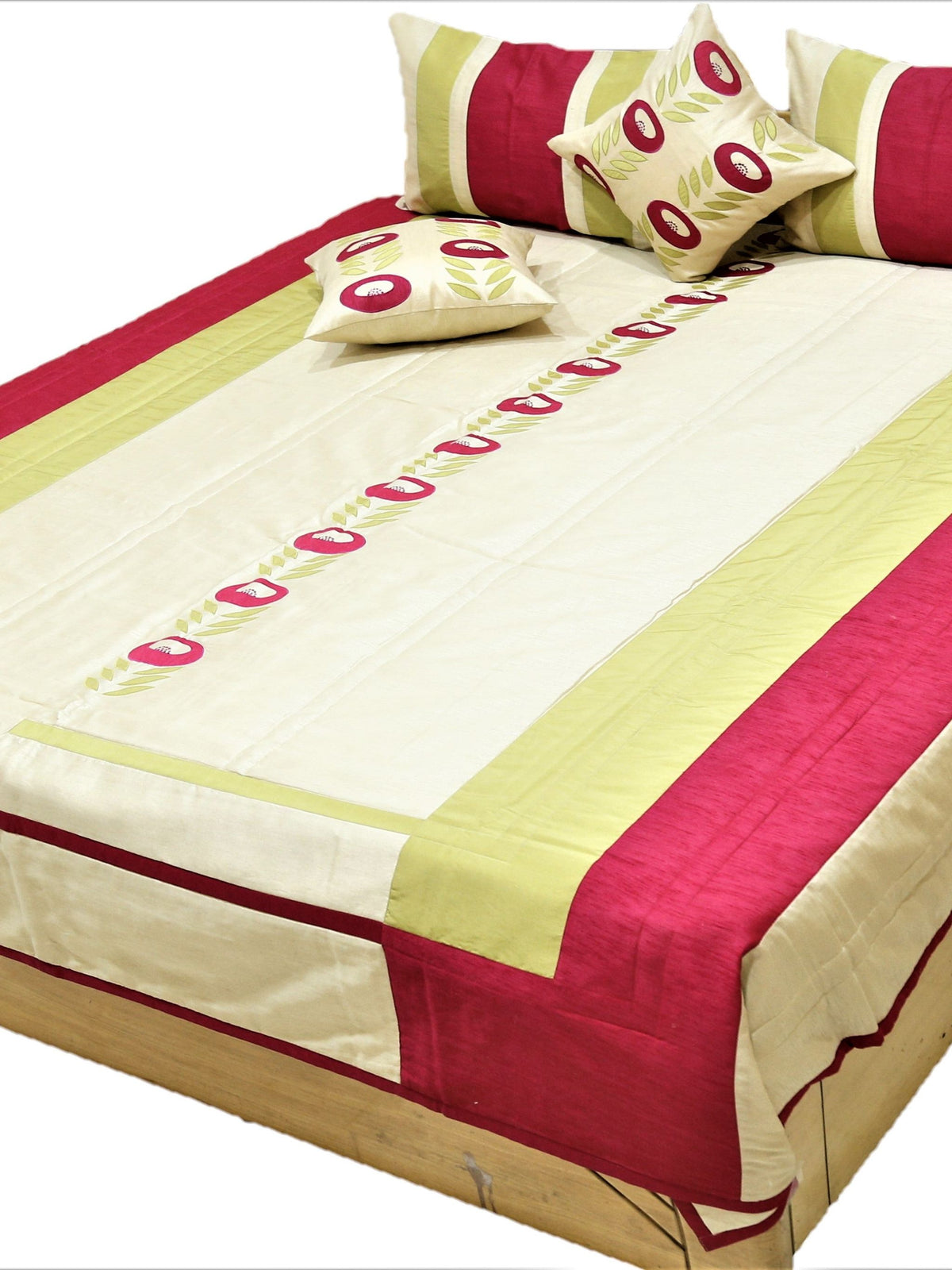 Cream and crimson striped quilted bedcover set made up on a double bed with bolsters