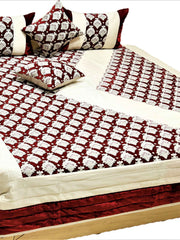 Maroon and cream traditional print quilted bedcover set made up on a double bed