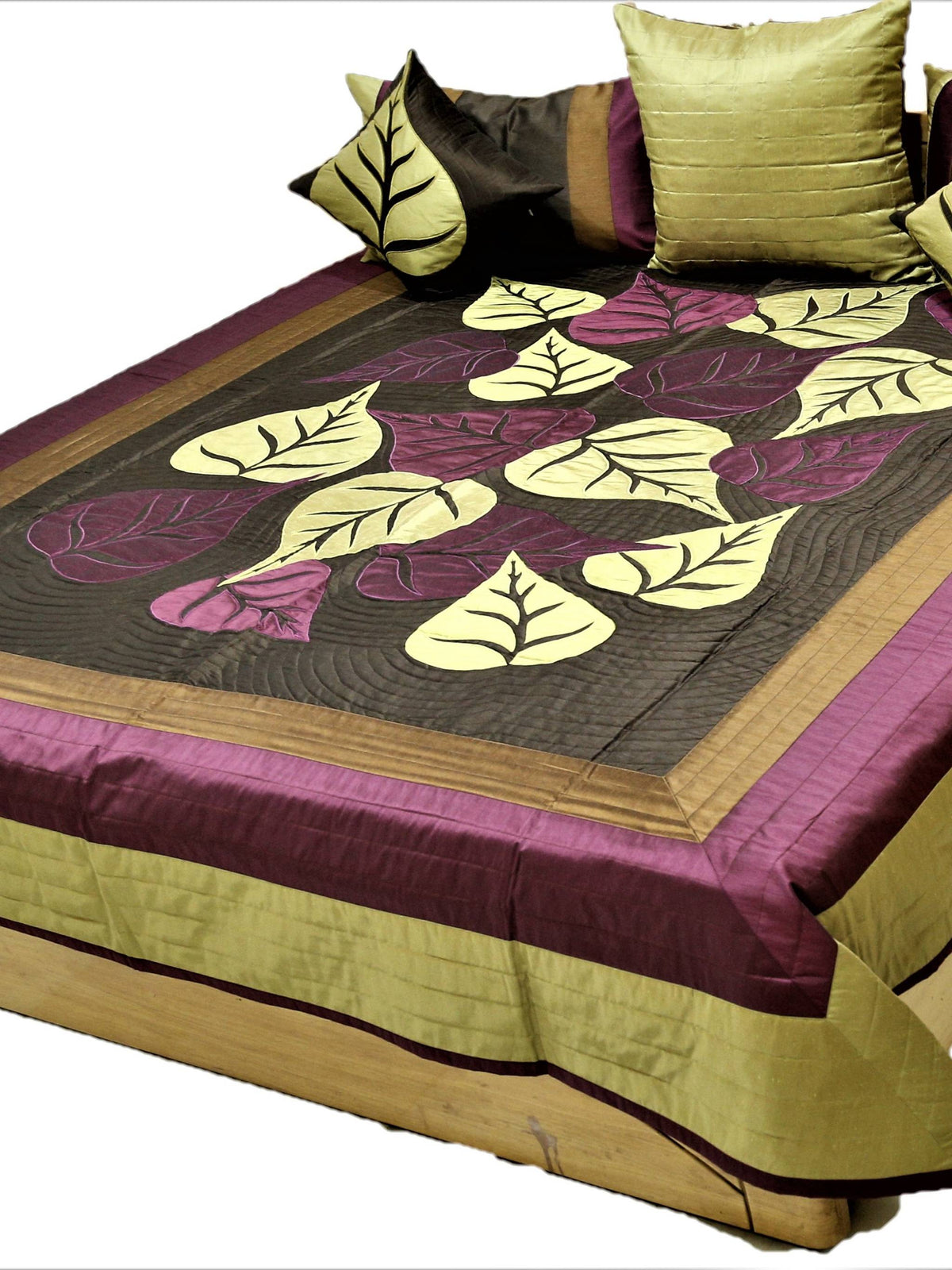 Dark brown silk bedcover with cream and aubergine leaf applique, olive and gold borders