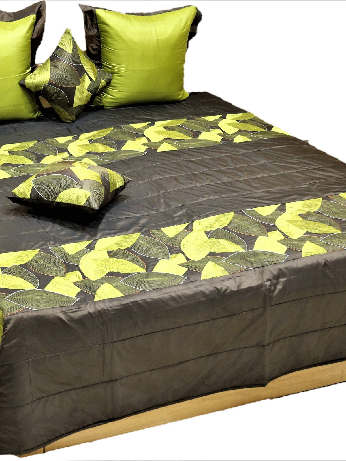 Charcoal brown quilted bedcover set with lime green leaf motifs and lime pillow covers
