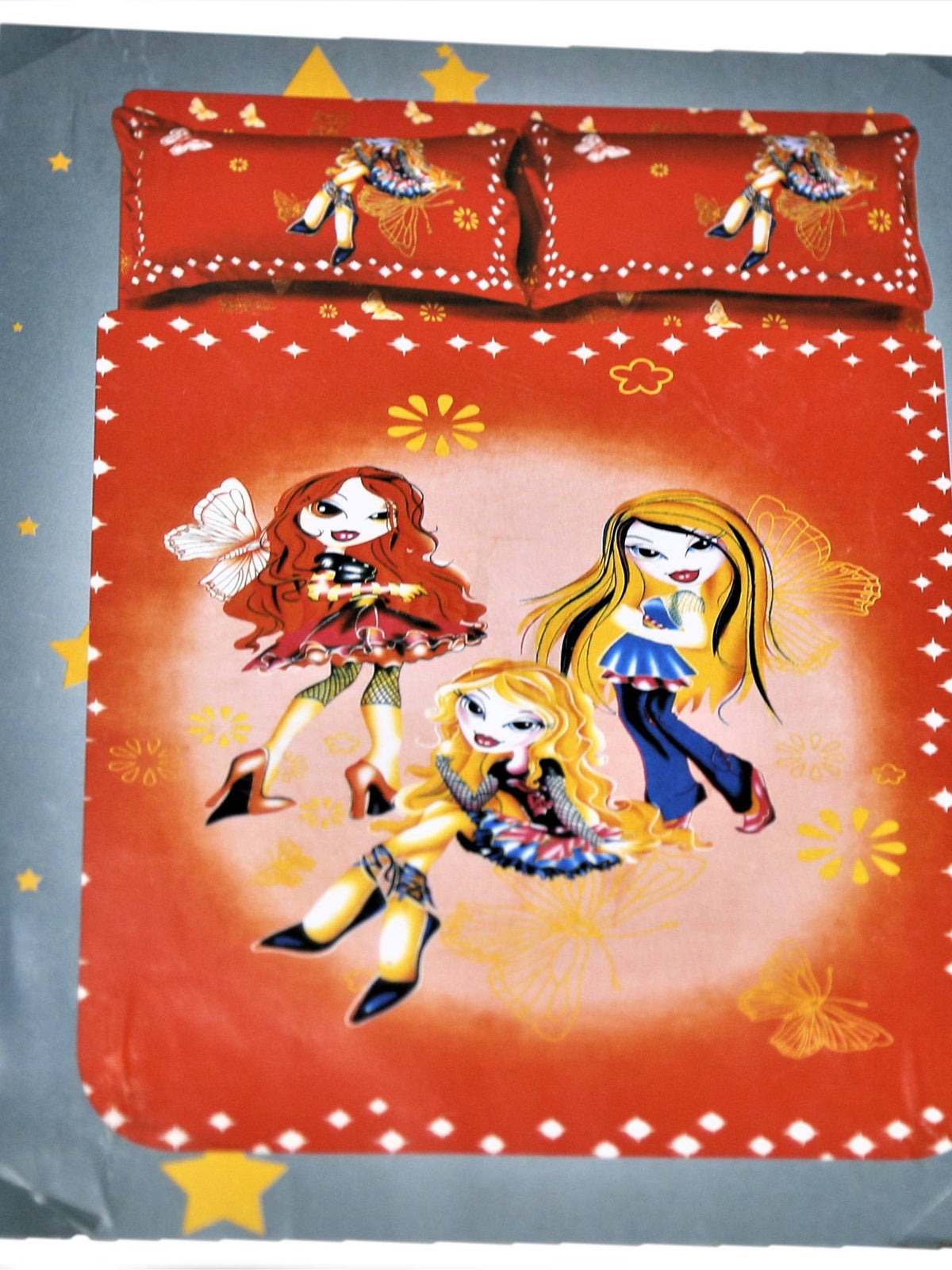 Rust-orange cartoon fashion-doll printed bedsheet set with matching pillow covers and star motifs, for a kids' bed