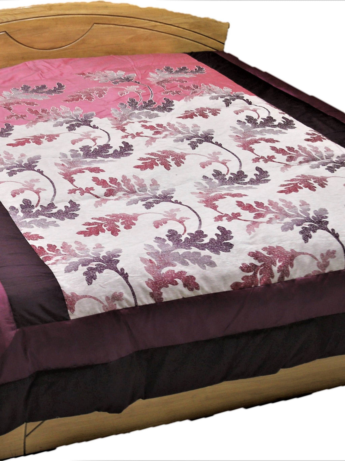 Rose-pink and wine down quilt with watercolour oak-leaf print for a double bed