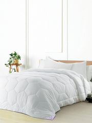 White microfiber quilt with honeycomb quilting texture