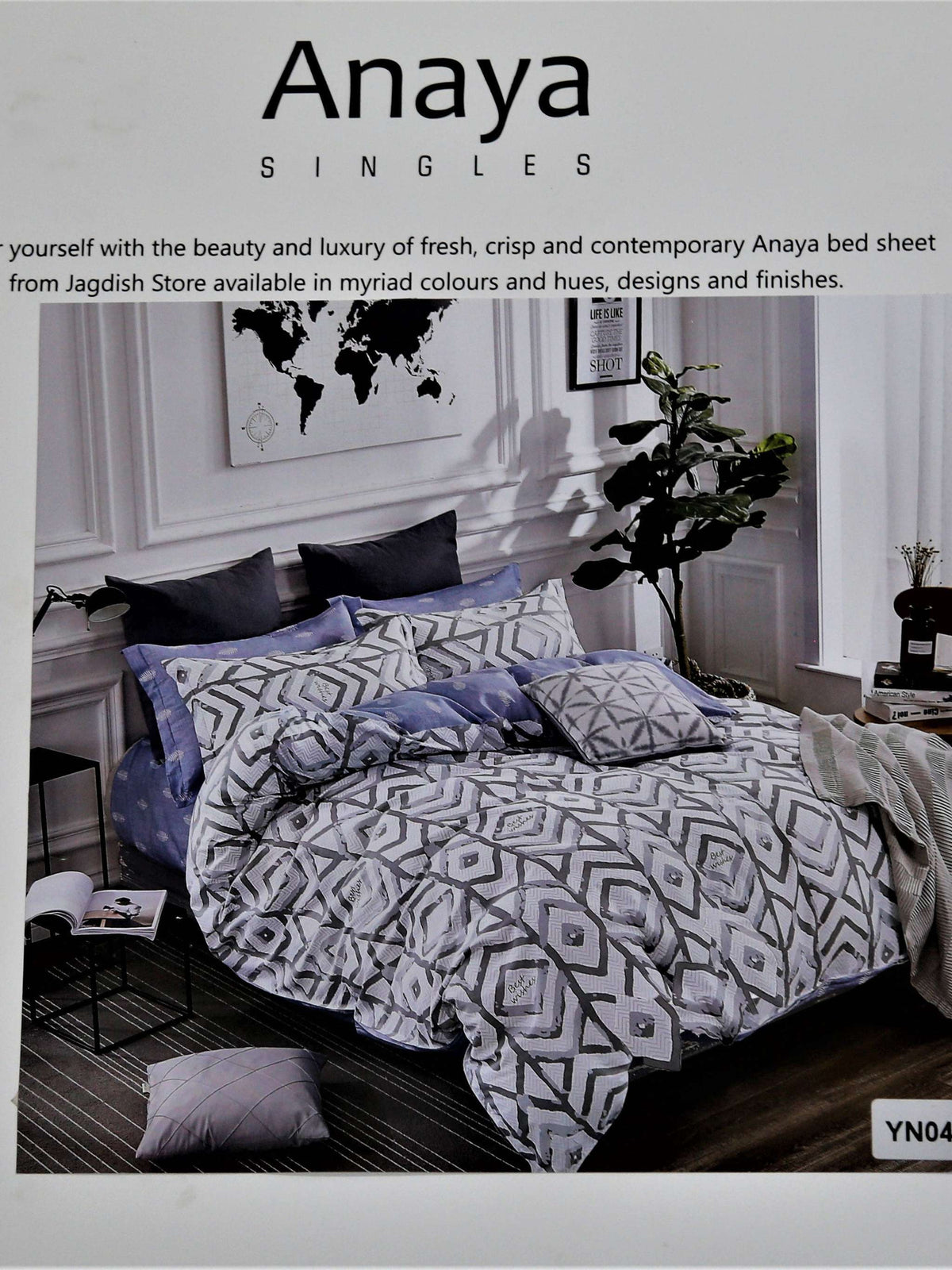 Anaya Singles packaging showing a lavender-grey and black diamond geometric printed bedding set styled on a bed