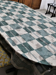 Green and cream checkered table cover with a self-tone floral jacquard pattern and a sheer green underskirt