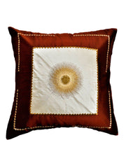 Rust silk cushion cover with an ivory centre panel and gold sunburst embroidery, gold bead trim
