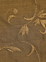 Rust-beige polysilk upholstery fabric with a tone-on-tone embroidered floral vine
