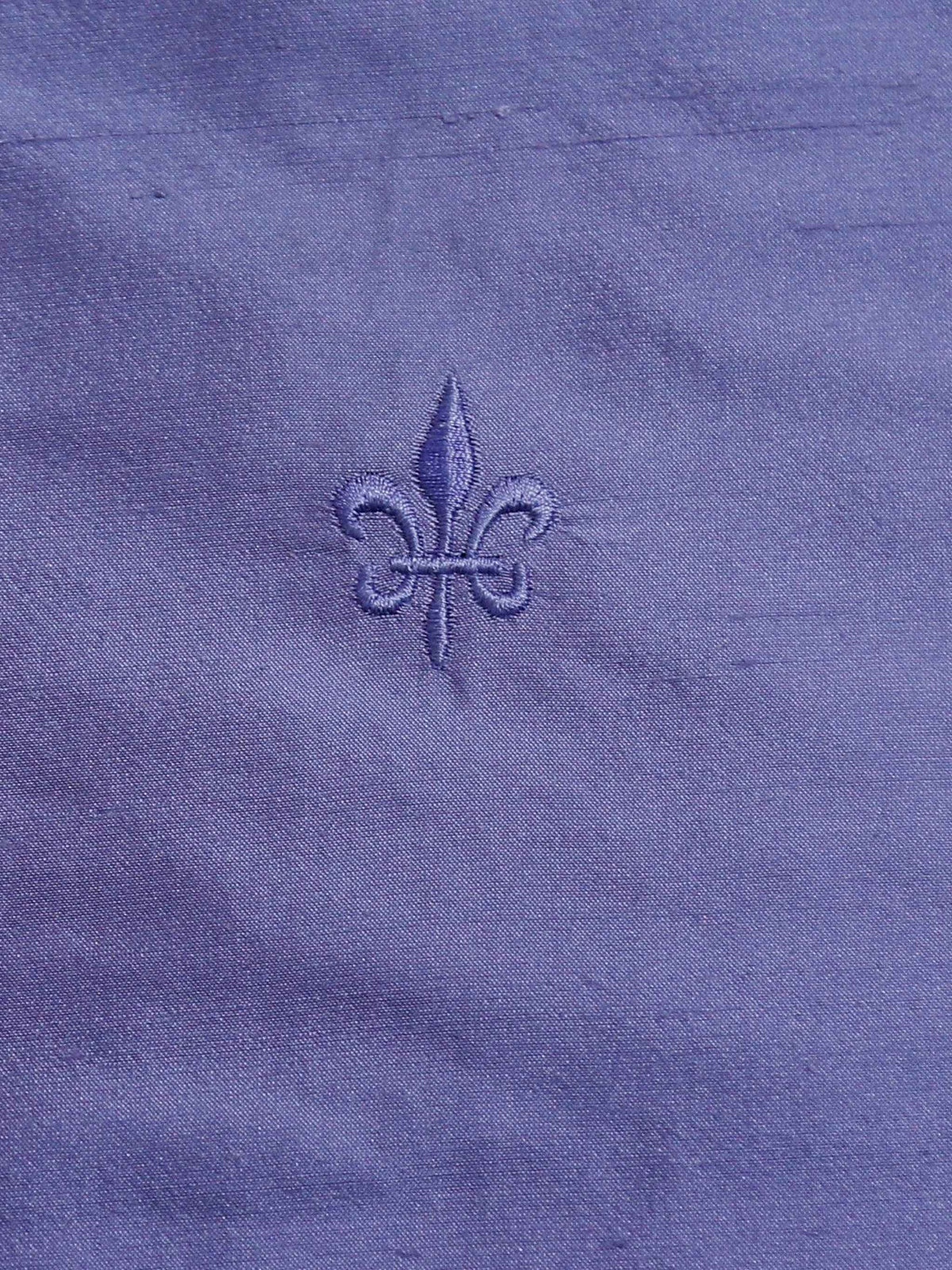 Lilac silk upholstery fabric with a tone-on-tone embroidered fleur-de-lis motif