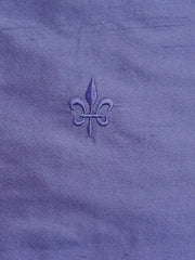 Lilac silk upholstery fabric with a tone-on-tone embroidered fleur-de-lis motif