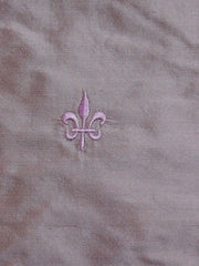 Mauve polysilk upholstery fabric with a tone-on-tone embroidered fleur-de-lis motif