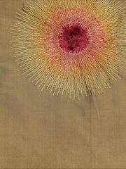 Tan silk upholstery fabric with a garnet-rose and gold embroidered sunburst motif