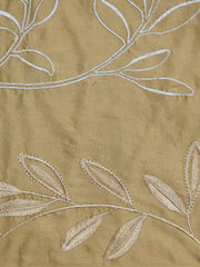 Tan silk upholstery fabric with a tone-on-tone embroidered leaf vine