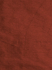 Sanchi plain silk upholstery fabric in deep rust with a matte woven surface