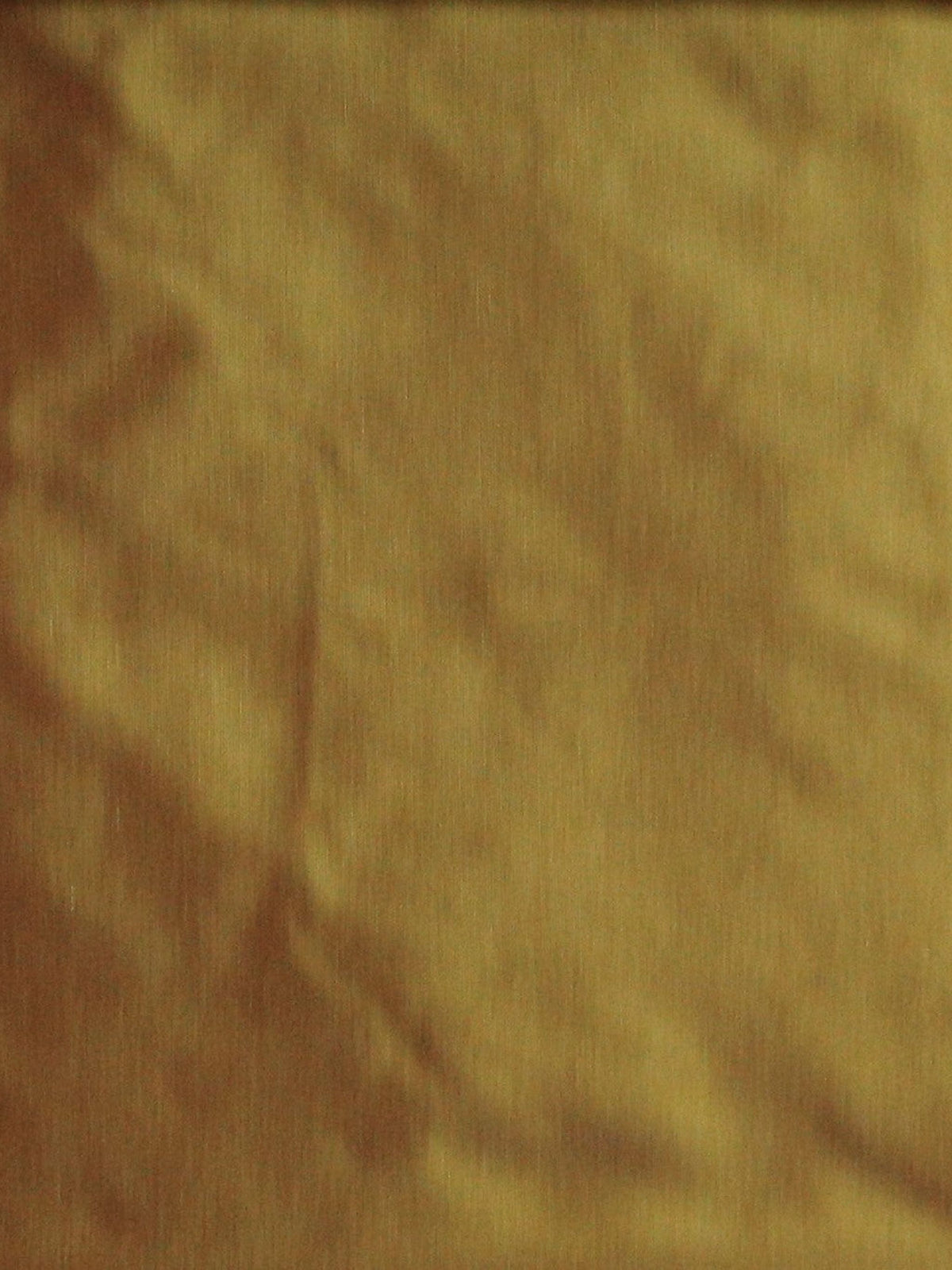Golden silk upholstery fabric in a plain, even colour